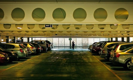 Cars lie parked in a line at the Milton Keynes Hospital multi-storey car park