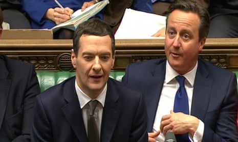 The chancellor, George Osborne, sits next to David Cameron after delivering his budget statement on 18 March 2015.