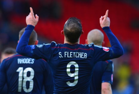 Steven Fletcher celebrates scoring his hat trick and Scotland's sixth.