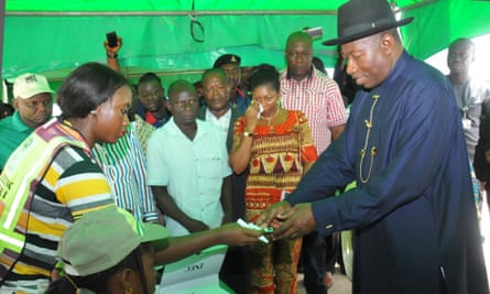 Incumbent president Goodluck Jonathan, right, is registered to vote in Otuoke, his home town, on Saturday.