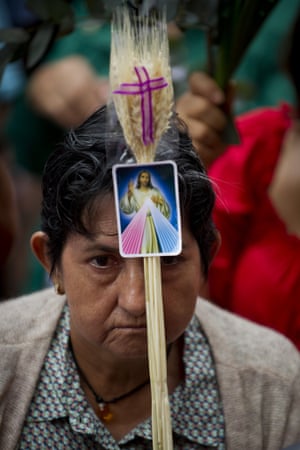 <strong>Cali, Valle del Cauca, Colombia</strong> A woman participates in a mass held as part of the Palm Sunday celebrations