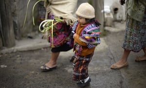 <strong>San Pedro Sacatepequez, Guatemala City</strong> A child holds a palm to take part in the procession