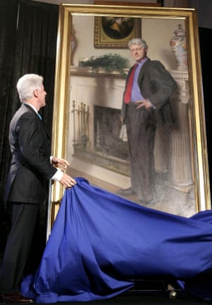 Bill Clinton looking up at his portrait