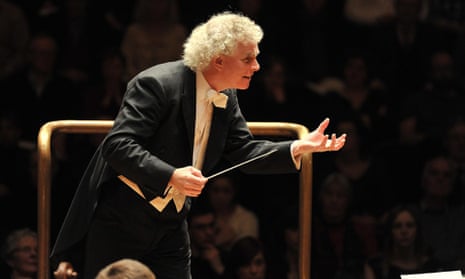 Simon Rattle conducts the Berlin Philharmonic at the Barbican, London, in 2011.