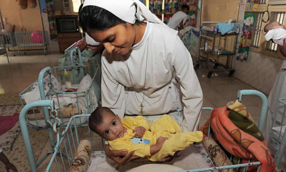 Orphaned Indian baby with nun