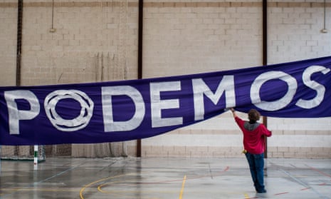 a Podemos political party banner being put up in Spain