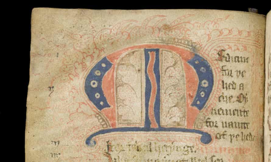 yellowed page with faint script (in latin) and a large decorative letter M.