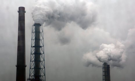 Smoke billows from chimneys of a steel plant on a hazy day in Hangzhou, Zhejiang province, China