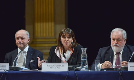 Laurent Fabius (l), foreign minister and future president of COP21, Anne Hidalgo, Mayor of Paris and Arias Canete, European commissioner for the climate action and energy at the COP21 climate talks climate meeting in Paris on 26 Mar 2015