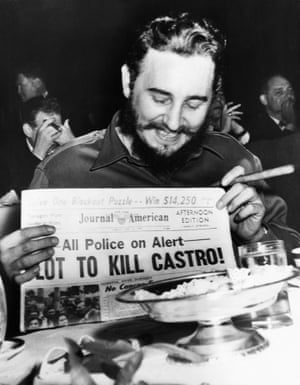 1959, Manhattan, New York. Seeming quite amused, Castro, now Cuban Prime Minister, holds up a newspaper headlining the discovery of a plot to kill him. Police said five brothers had been sent to New York from Philadelphia to assassinate him. When asked about a reported assassination attempt, Castro had replied, “In Cuba, they had tanks, planes and they run away. So what are they going to do here? I sleep well and don’t worry at all.”