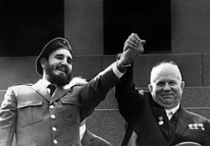 Holding the hand of Soviet leader Nikita Khrushchev during a four-week official visit to Moscow, 1963