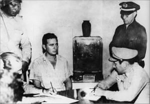 Castro is questioned by police and military officials at the Vivac prison in Santiago de Cuba after he and some 140 rebels attacked the federal garrison at Moncada, the first armed action of the Cuban Revolution in 1953
