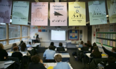 Cards displaying maths theories are displayed in a class room at a secondary school in London