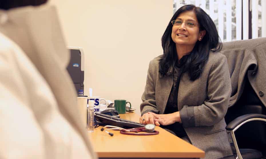 Dr Veena Jha with a patient at Manor House GP surgery in Glossop.