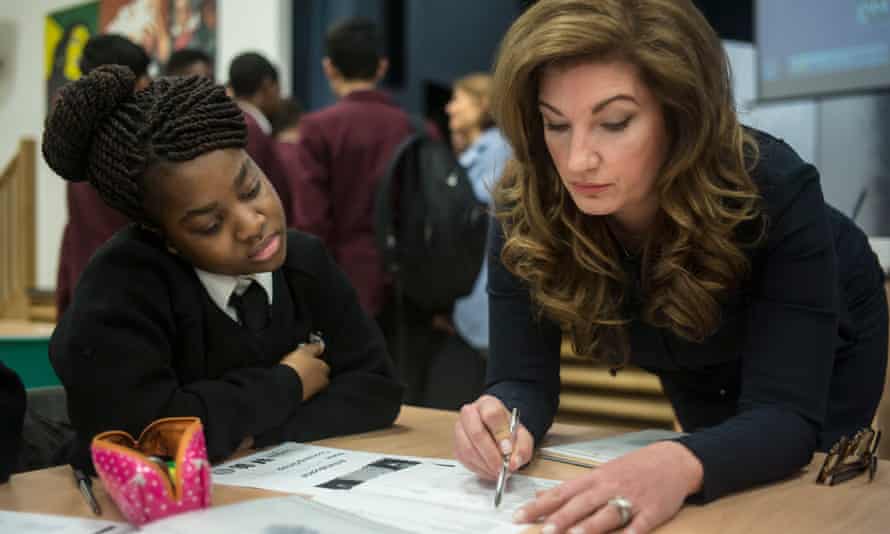 Karren Brady coaches pupils in writing a CV at a school in Mitcham, south London.