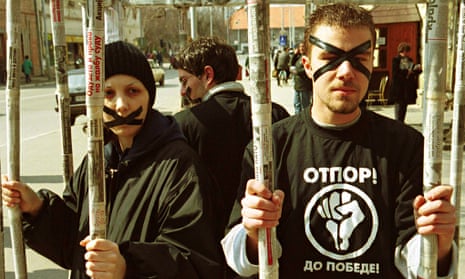 Otpor members protest in a mock cage.