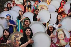 Turkish Kurdish women play music during an International Women's Day event in Mardin,