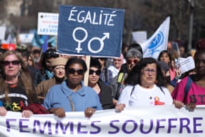 A women holds a banner reading 'Equality' during a demonstration in Marseille, France