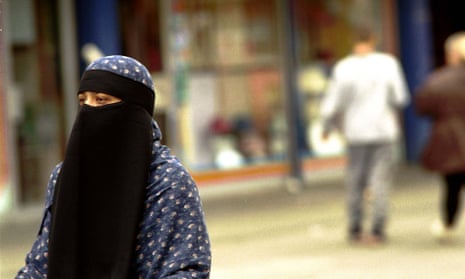 A fully veiled Muslim woman in Tower Hamlets. The leaked draft, which calls for the government to be more assertive in promoting 'British values', says extremism has been allowed to go unchallenged in the east London borough.