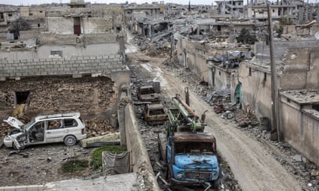 Rubble and damaged buildings are seen in the devastated Syrian city of Kobani in January.