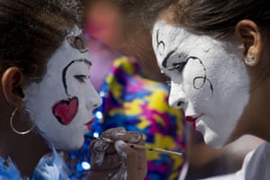 <strong>Managua, Nicaragua <br></strong>A<strong> </strong>woman paints girl’s face during an anti-government march organised by women’s rights organisations to commemorate International Women’s Day
