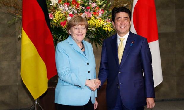 Angela Merkel with Shinzo Abe in Tokyo on 9 March.
