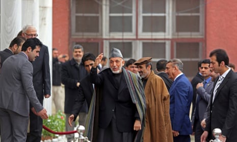 Hamid Karzai, centre, arrives at parliament in Kabul on Saturday.