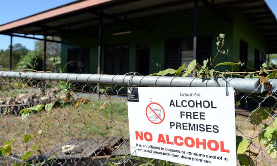 A sign reading "Alcohol Free Premises" on a fence outside a house in the Indigenous community of Bagot in Darwin