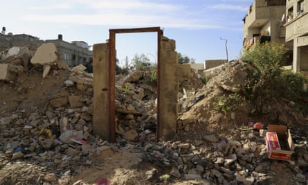 The now empty doorway on the rubble of a building destroyed in last summer’s Israel-Hamas war