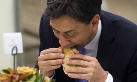 Ed Miliband, leader of The Labour Party eating a bacon sandwich with red sauce during a visit to New Covent Garden Flower Market on the eve of the European