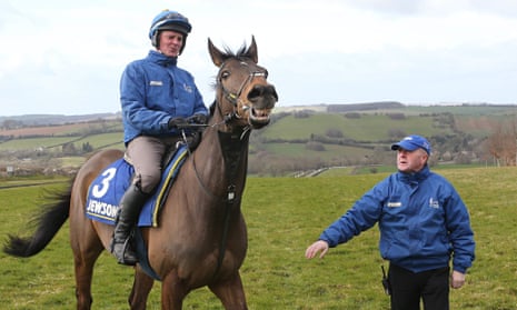 Jonjo O'Neill looks on as his Grand National hope Shutthefrontdoor starts a workout
