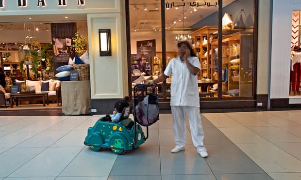 A domestic worker in The Avenues shopping mall, Kuwait City. The country has the highest ratio of domestic workers to citizens in the Middle East.