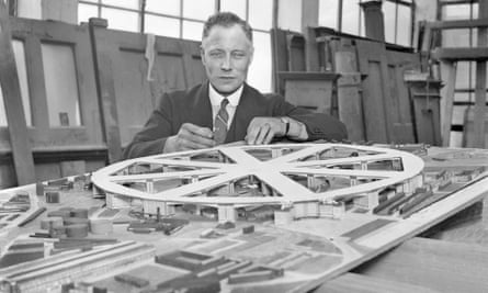 Architect Chas Glover with a model for an airport to be built over the roofs of Kings Cross and St Pancras railway stations.