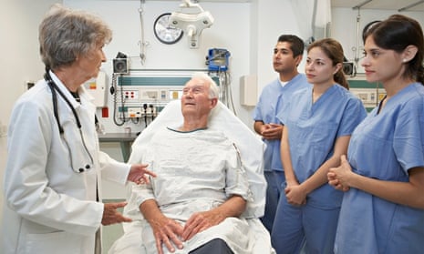 Medical students with patient and senior doctor