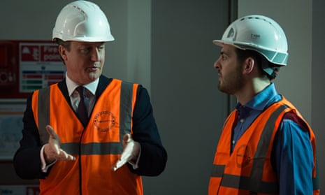 Hard-hat: check. Hi-vis vest: check ... David Cameron goes to work. Photograph: Leon Neal/AFP/Getty 