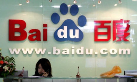 A receptionist works behind the logo for Baidu.com, the Chinese search engine whose customers were hijacked by the first firing of the Great Cannon.