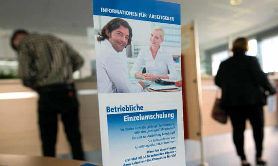 Jobseekers wait to be seen at a jobcentre in Hamburg, Germany
