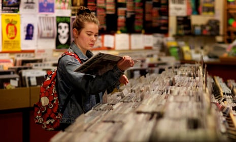 A young woman browses vinyl at Jumbo Records shop in Leeds, in April 2014