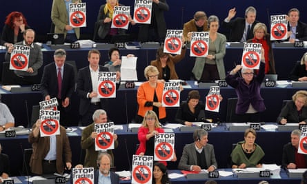 Members of the the Group of the Greens/European Free Alliance of the European Parliament hold leaflets with the slogan Stop Fracking 