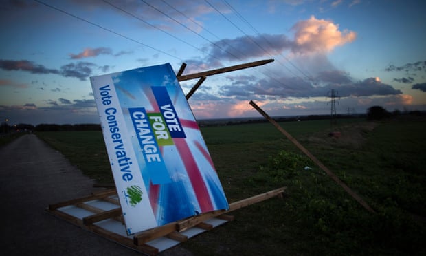   A Conservative election billboard is blown over in high winds in a field near Ramsgate