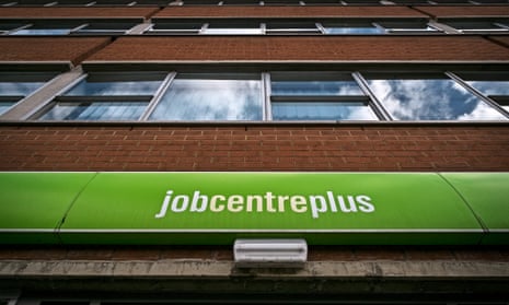 Jobcentre sign, looking up at multi-storey building