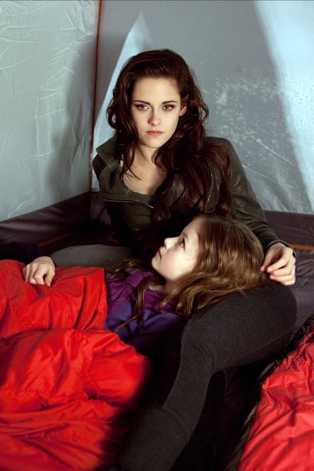 Kristen Stewart and Mackenzie Foy in The Twilight Saga: Breaking Dawn – Part 2, adapted from Stephenie Meyer's novels.