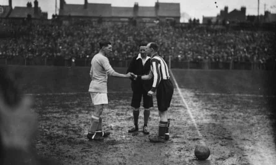 Reading’s captain, Robert ‘Bert’ Eggo, right, shakes hands with his Cardiff City counterpart, Fred Keenor, before the 1927 FA Cup semi-final at Molineux.