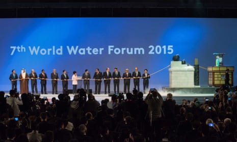 Leaders prepare to pull a rope connected to a 'water clock' as they attend the opening ceremony of the 7th World Water Forum in Daegu.