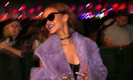 Rihanna smokes a cigar at Coachella.