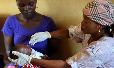 A baby receives a vaccine in Freetown, Sierra Leone