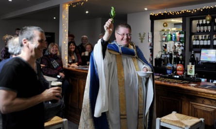 Vicar John Hall blesses the Bevy pub in Brighton after its rescue by a co-op.