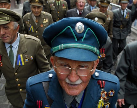 Veterans dressed in historical uniforms of the Ukrainian Insurgent Army (UPA) march to celebrate Heroes Day.