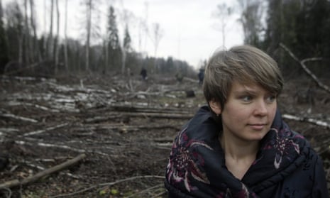 Environmental activist Yevgenia Chirikova stands in a clearing, in the Khimki forest north of Moscow, Russia.