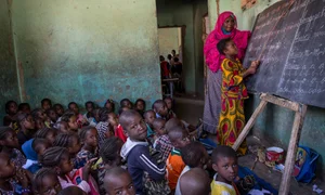 Students from different ethnic groups attend a class together at a school in Gao, Mali,